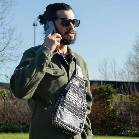 Urban Caravan crossbody bag in black and natural cotton-viscose jacquard with bold geometric woven pattern