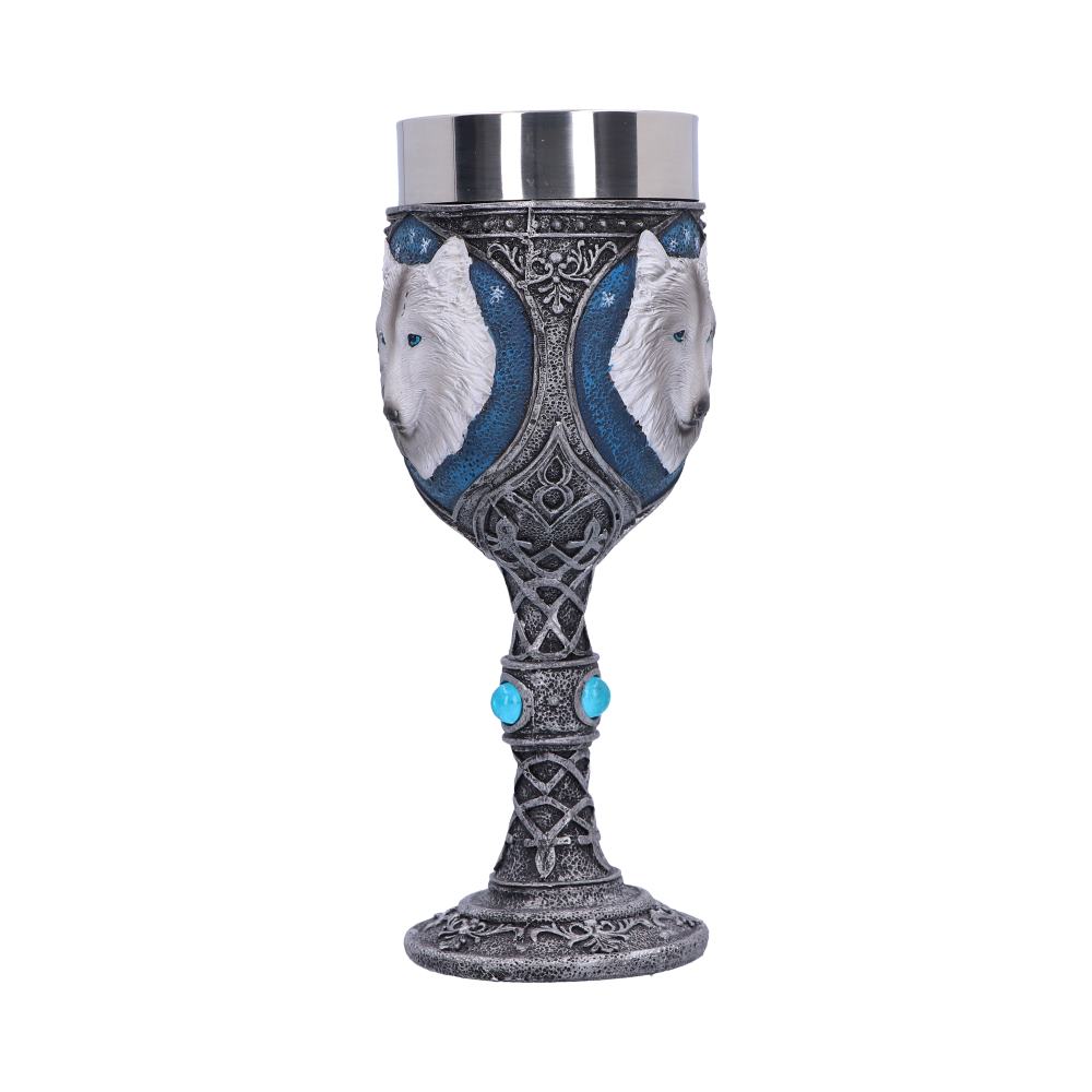 A silver chalice with a metal cup features wolf head designs on either side. The stem is adorned with blue gemstones and Celtic knots.