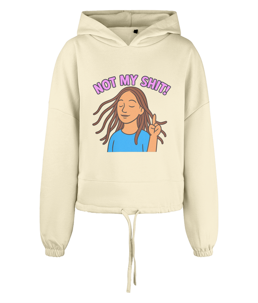 Hoodie displaying an illustrated woman flipping a peace sign with eyes closed and hair blowing, captioned "NOT MY SHIT!", centered on a cream cropped drawstring hoodie against black background.