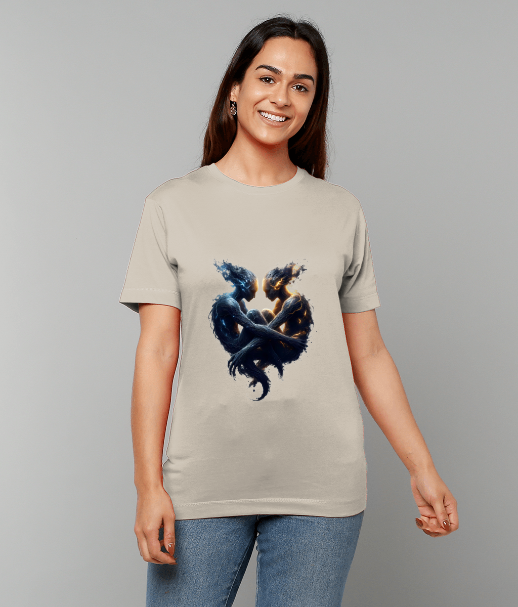 Beige T-shirt graphic depicting two elemental figures, one blue and watery, one glowing orange and fiery, entwined to form a heart while a smiling woman stands against a gray background.