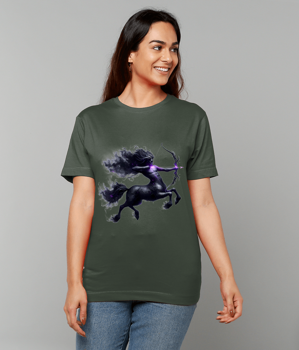 Olive green T-shirt displaying a dark centaur archer rearing and drawing a glowing purple bow, worn by a smiling woman standing against a plain light gray background.