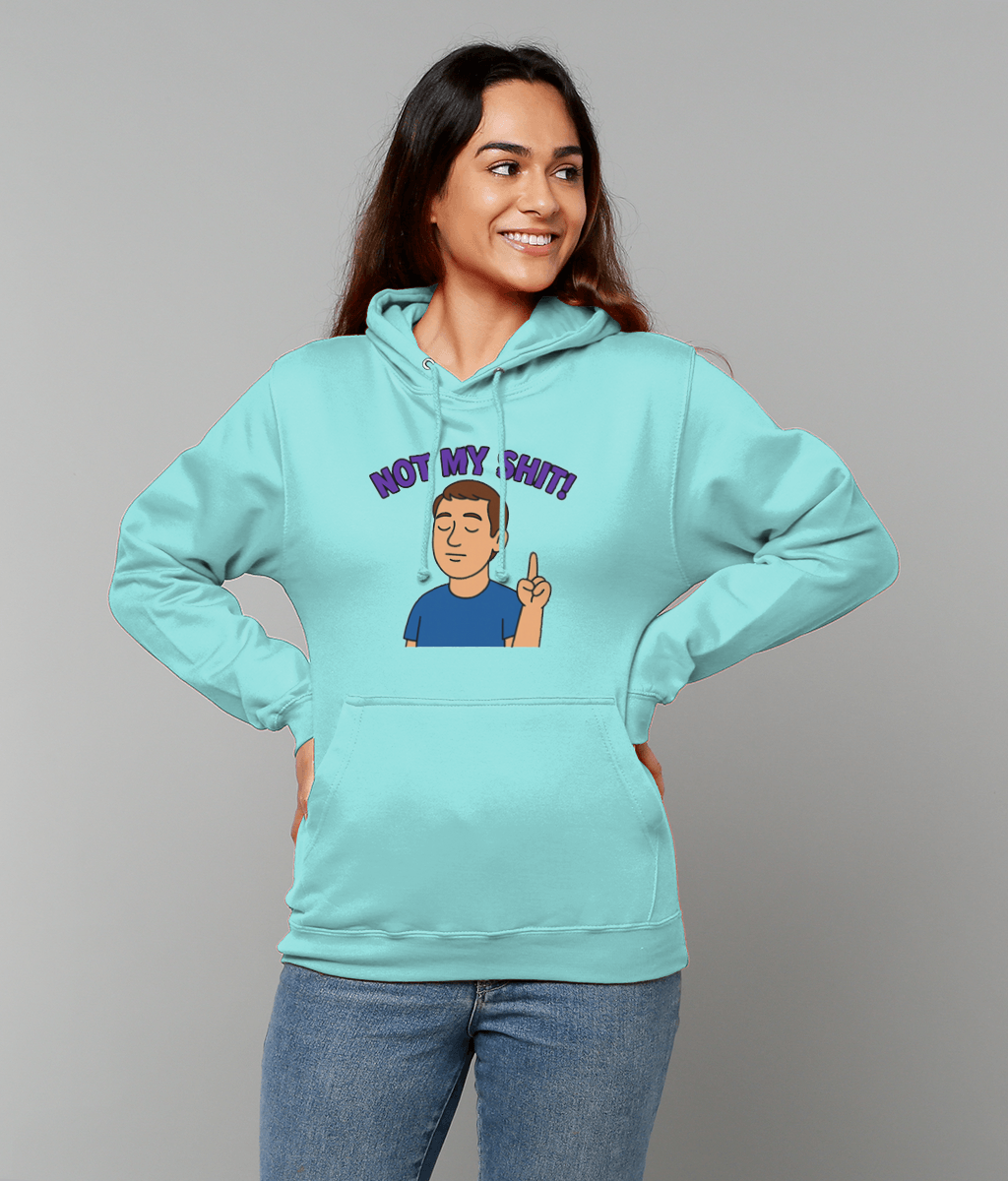 A woman wearing a light turquoise hoodie printed with a cartoon man and the text "NOT MY SHIT!" smiles with hands on hips against a neutral gray background.