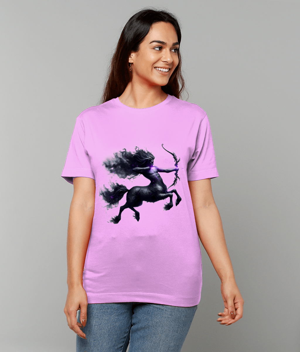 Lavender T-shirt displaying a smoky black centaur rearing and drawing a bow, worn by a smiling woman standing against a plain light gray background.