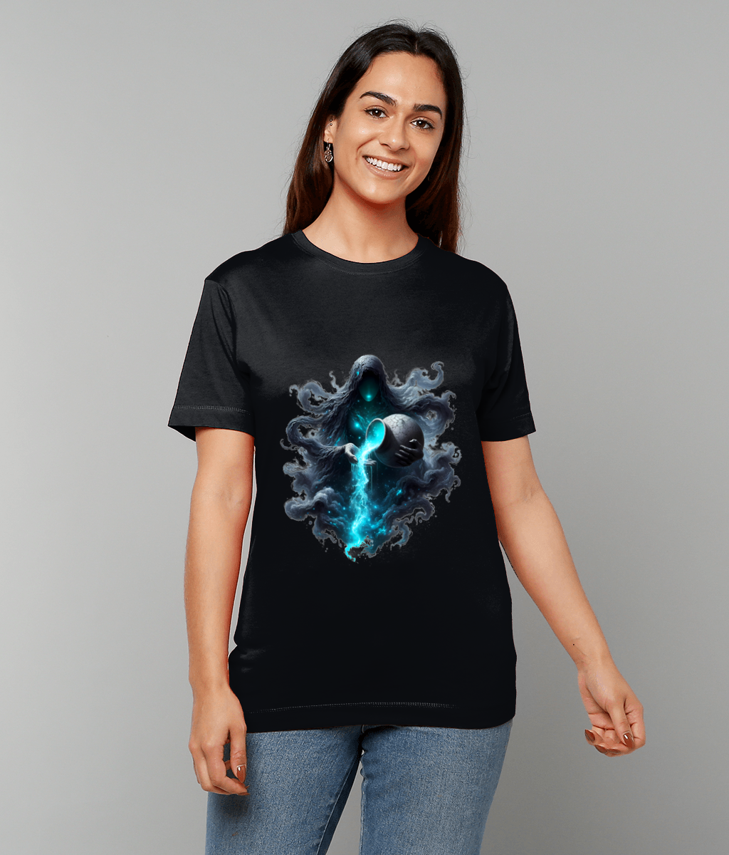 A hooded spectral figure on a black T-shirt holds a cracked orb pouring bright blue energy, worn by a smiling woman standing against a plain light gray studio background.