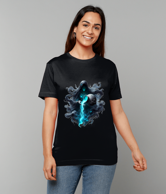 A hooded spectral figure on a black T-shirt holds a cracked orb pouring bright blue energy, worn by a smiling woman standing against a plain light gray studio background.