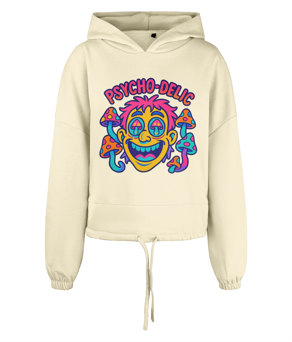Cream cropped hoodie displaying text "PSYCHO-DELlC" above a colorful cartoon face with droopy eyes and surrounding spotted mushrooms on a plain black background.