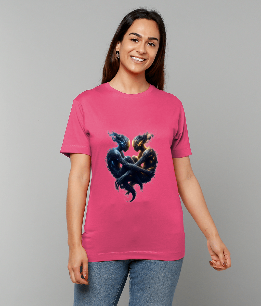 Pink T-shirt displays two intertwined elemental humanoid figures, one blue and one gold, forming a heart around a glowing orb while a smiling woman wears it against a gray background.