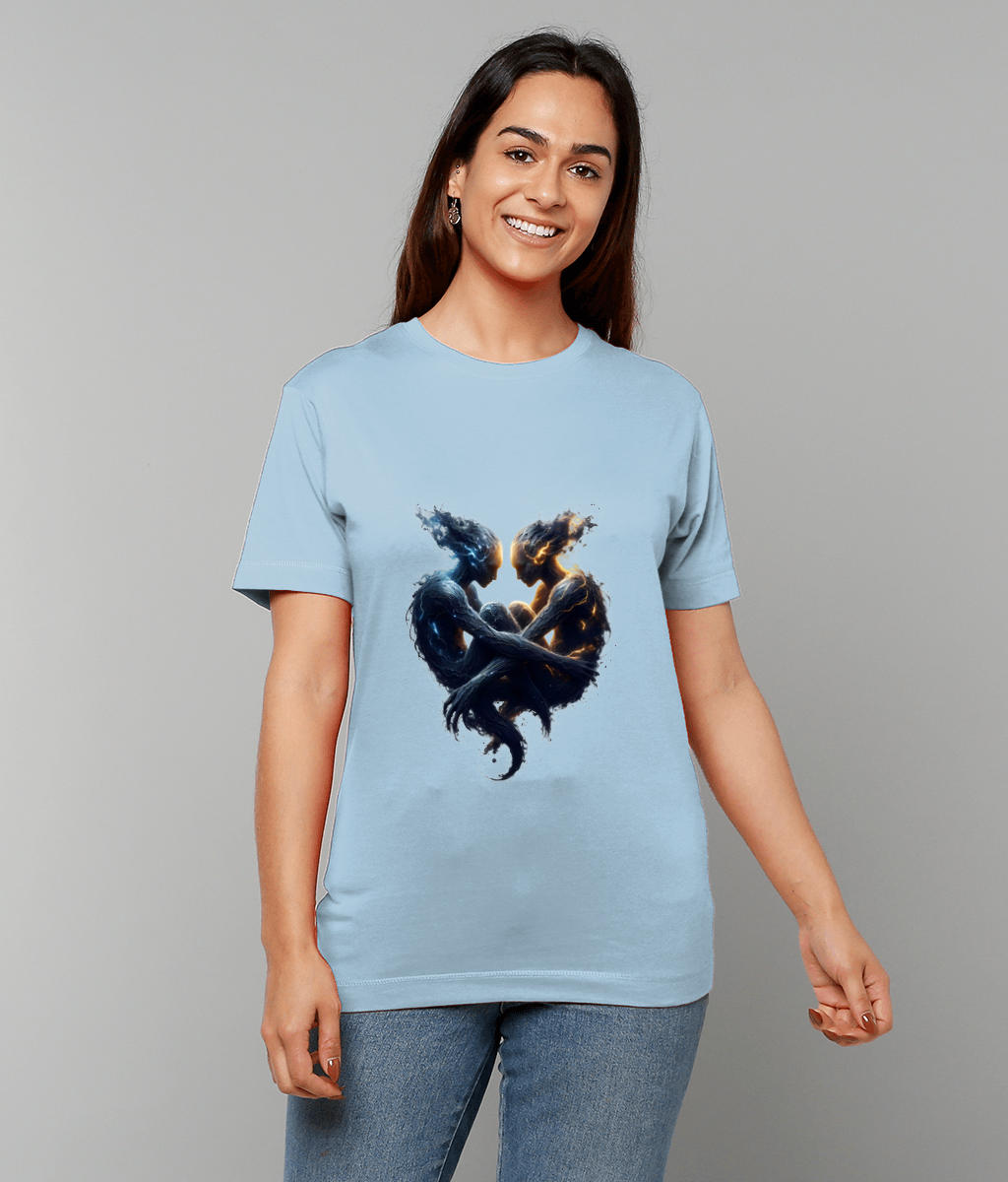 Light-blue T-shirt depicts two entwined ethereal figures forming a heart while a smiling woman wears it standing against a plain gray background.
