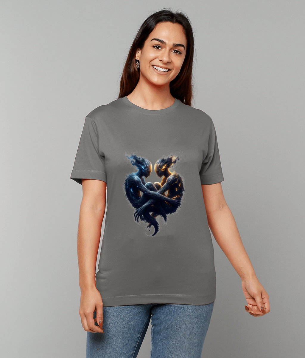 Gray T-shirt featuring two intertwined elemental figures facing and embracing to form a heart, modeled by a smiling woman standing against a plain light-gray background wearing blue jeans.