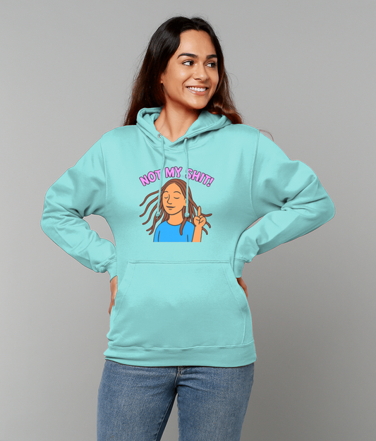 Woman wearing a turquoise hoodie printed with a cartoon of a relaxed woman flashing a peace sign and the text "NOT MY SHIT!" stands hands on hips smiling against a plain gray background.