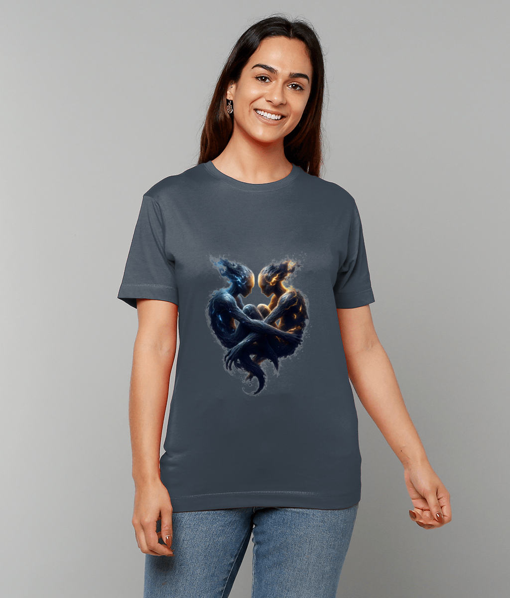 Graphic t-shirt displays two glowing elemental humanoid figures entwined facing each other, modeled by a smiling woman standing against a neutral light grey background.