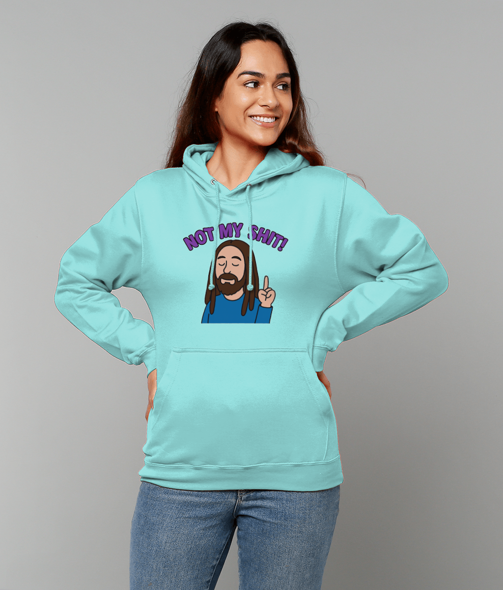 Woman wearing turquoise hoodie printed with cartoon bearded man and text 'NOT MY SHIT!' stands with hands on hips, smiling and looking to the side against a plain gray background.