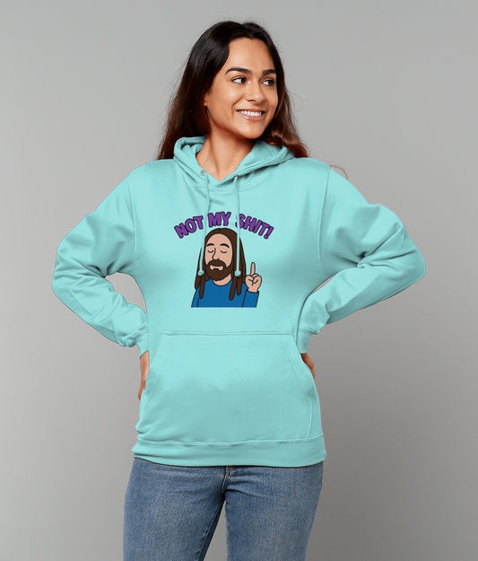 Woman wearing turquoise hoodie printed with cartoon bearded man and text 'NOT MY SHIT!' stands with hands on hips, smiling and looking to the side against a plain gray background.