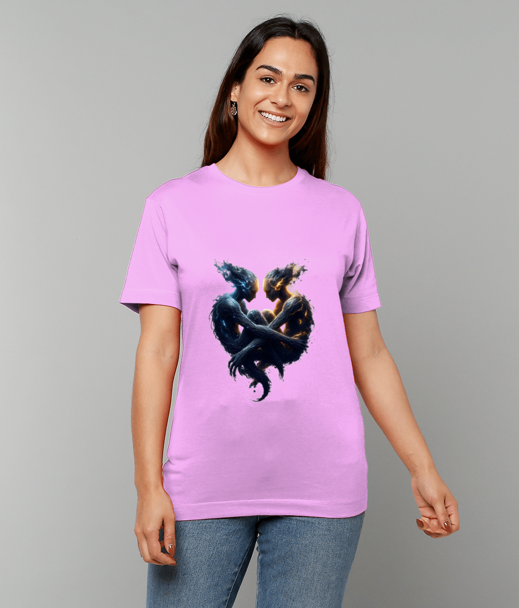 Lavender T-shirt displays two ethereal humanoid figures entwined into a heart shape; person wearing it smiles while standing against a plain gray background.