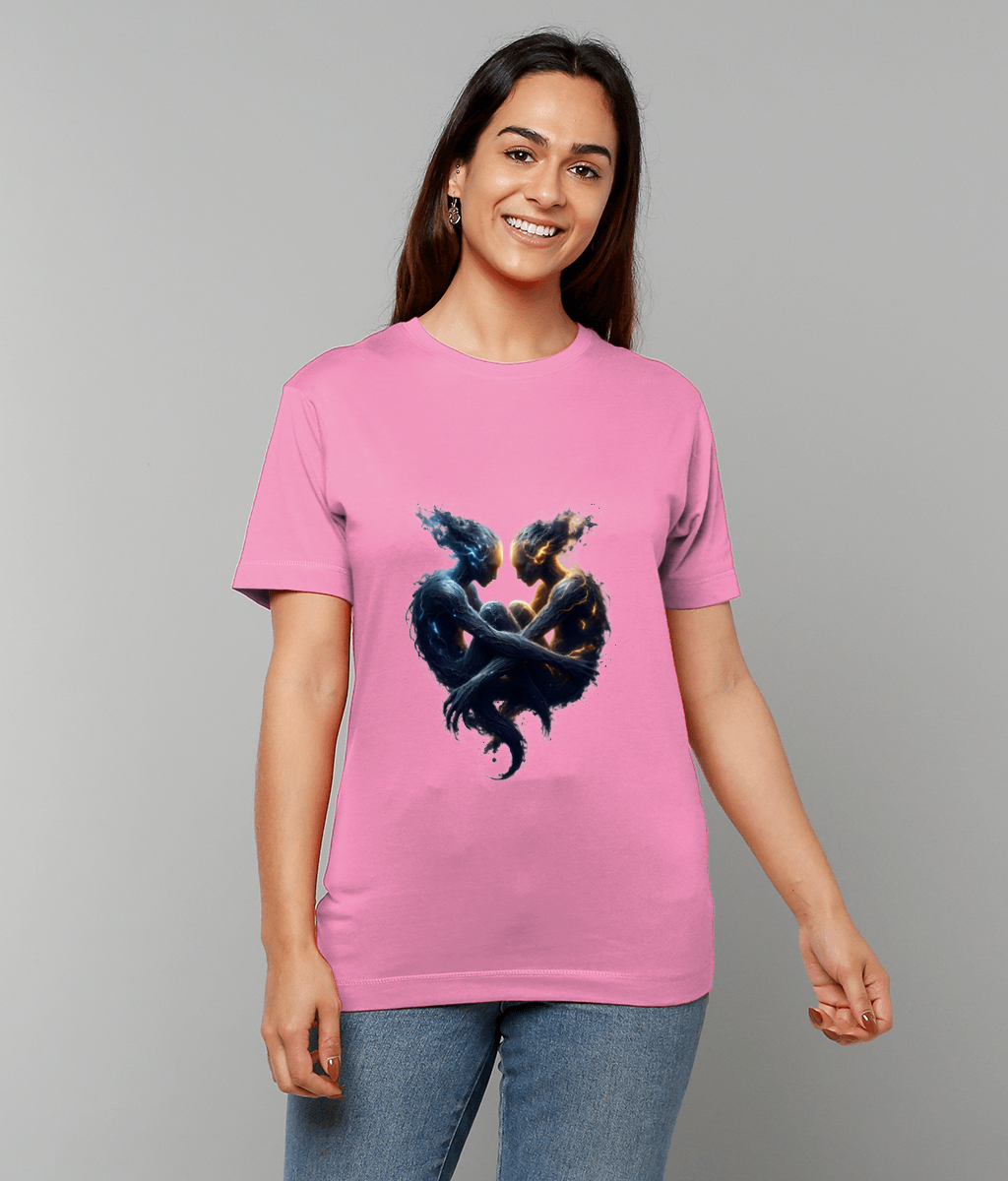 Pink T-shirt displaying two intertwined ethereal humanoid figures forming a heart, the figures facing each other with glowing accents; worn by a smiling woman against a plain gray background.