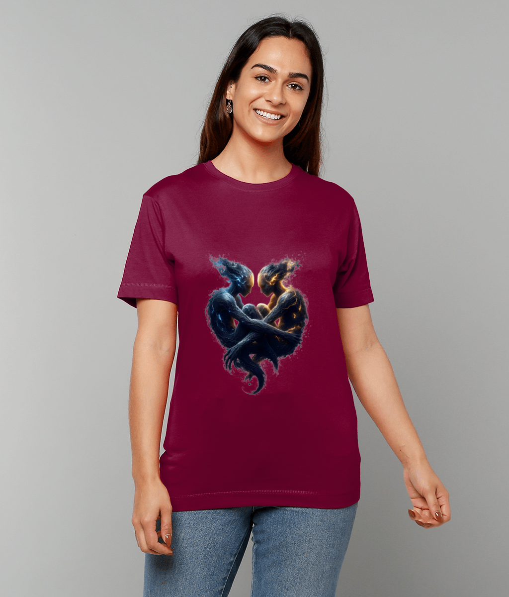 Maroon t-shirt featuring two intertwined ethereal figures facing and embracing to form a glowing heart motif on a woman standing against a neutral gray backdrop.