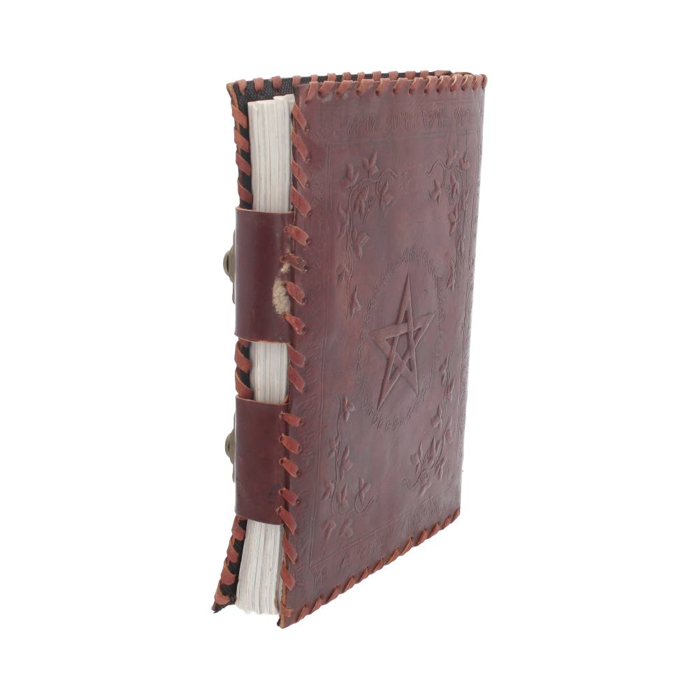 A leather-bound journal stands upright. Its cover features an embossed pentagram surrounded by floral designs. The spine is bound with leather straps, amidst a plain white background.