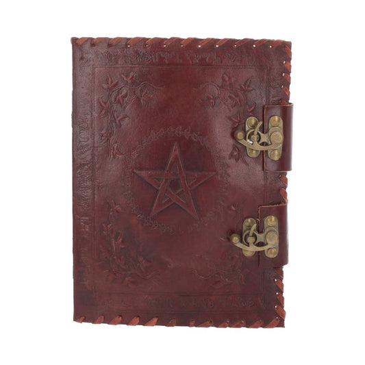 A dark red, leather-bound journal sits closed, secured by two antique bronze clasps, and a raised pentagram design encircled by foliage dominates the cover.