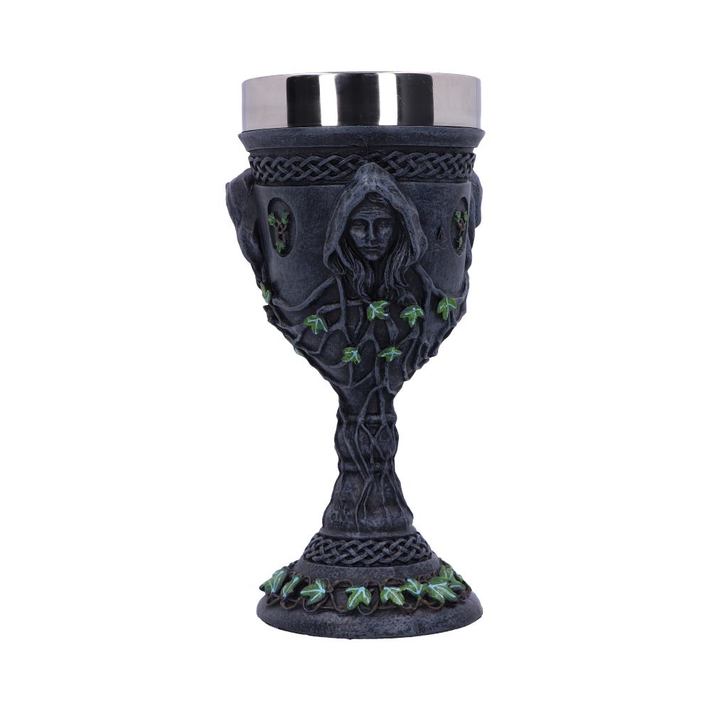 A pewter goblet, embellished with Celtic knots, a robed woman and green ivy designs, sits on a white background. The goblet's drinking area has a shiny silver rim.