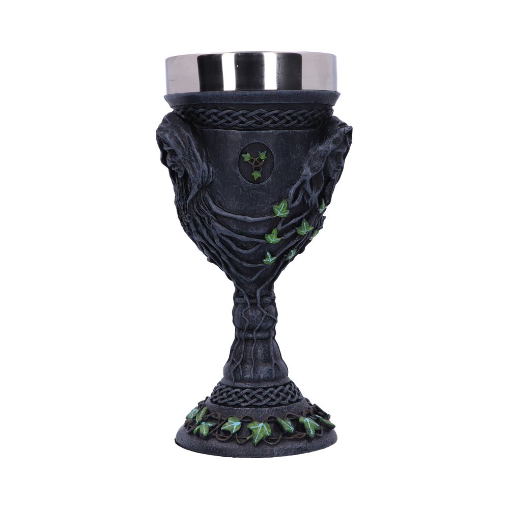 An ornate, stemmed goblet with a silver-colored cup sits on a white background. Dark figures are worked into the chalice's design, along with ivy leaves.