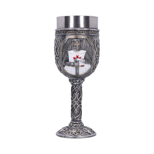 A silver goblet displays a Crusader figure holding a sword on its cup. The goblet has a detailed base and stem on a white background.
