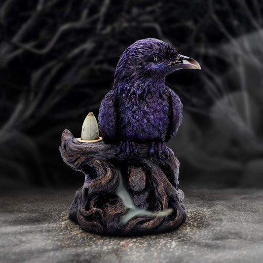 A purple carved raven perches on a gnarled wooden stump holding a cone incense burner while pale smoke drifts from its roots against a foggy, shadowed forest background.