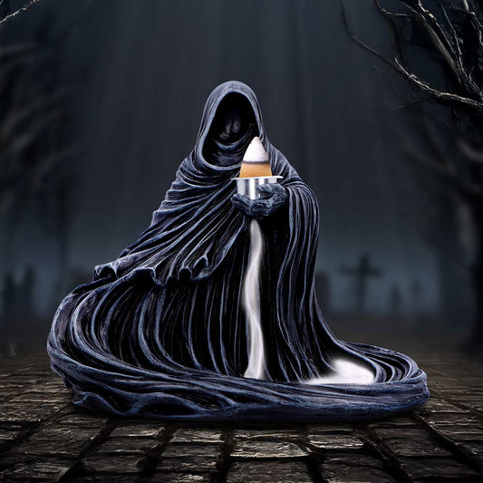 Hooded, faceless robed figure holds a lit incense cone on a metal dish while white smoke pours down its draped robes in a foggy graveyard with bare trees and cobblestones.
