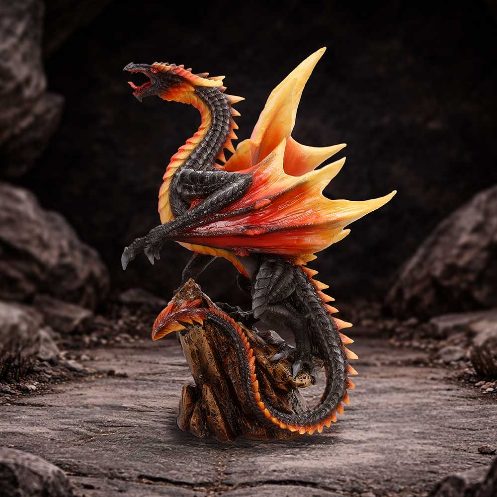 Obsidian Inferno Black Dragon Figurine - black dragon with flame-coloured wings on dark rocks