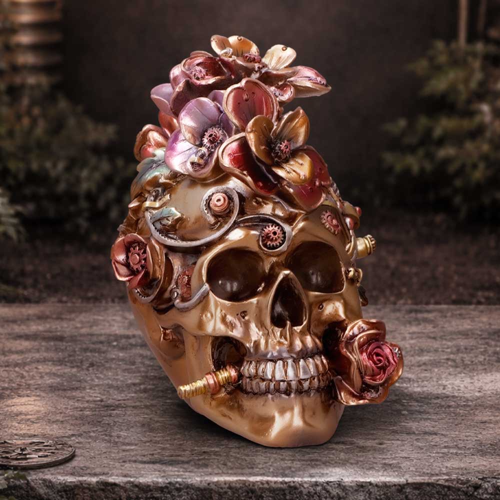 Clockwork Bloom Bronze Steampunk Skull Ornament - bronze-toned floral skull in a workshop display