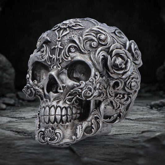 Gilded Memento gothic skull figurine with dark silver finish, sculpted floral swirls and miniature skull details by Nemesis Now