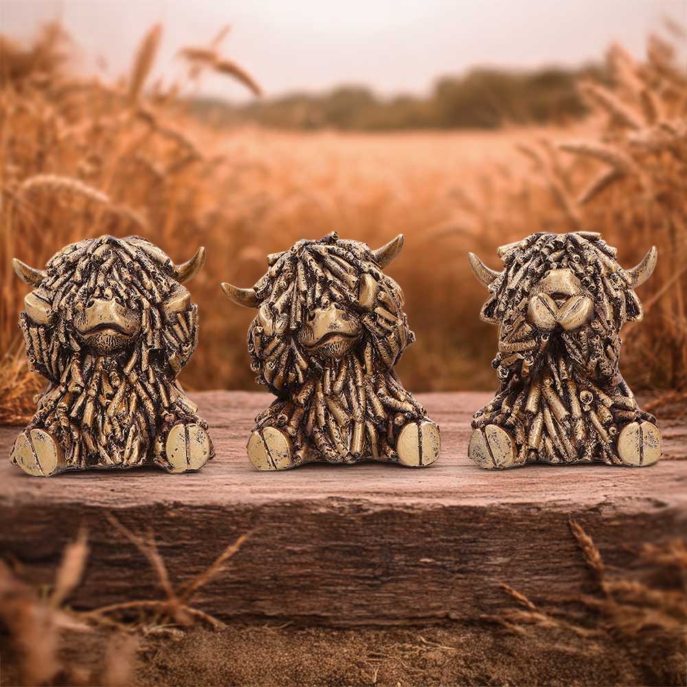 Three Wise Gold Highland Cows figurine set by Nemesis Now with three shaggy gold cows performing See No Evil, Hear No Evil and Speak No Evil poses