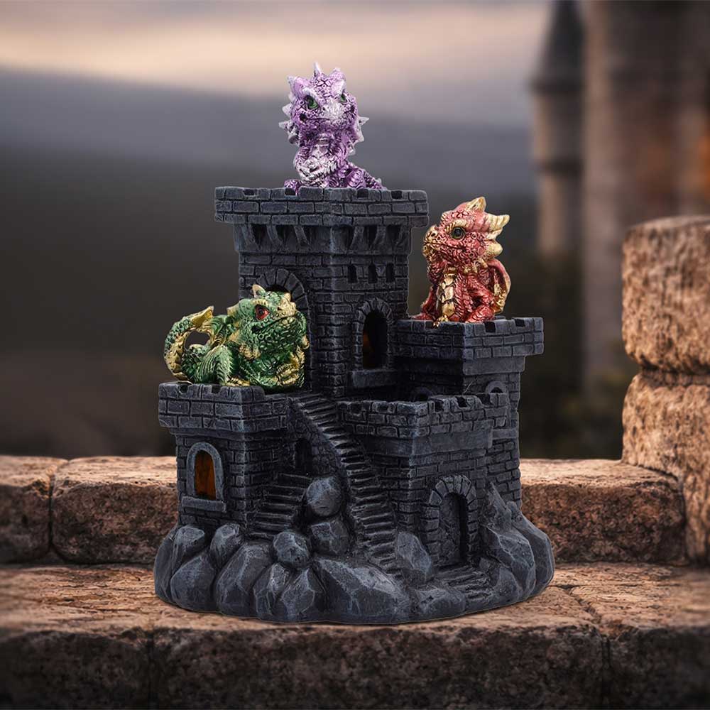 Dragonlings Keep Light-Up Castle - displayed with a warm light visible inside the castle windows