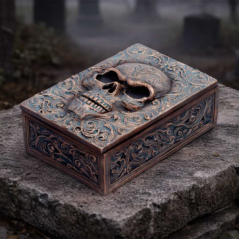 Treasured Remains Skull Trinket Box - skull keepsake box on a dark stone display