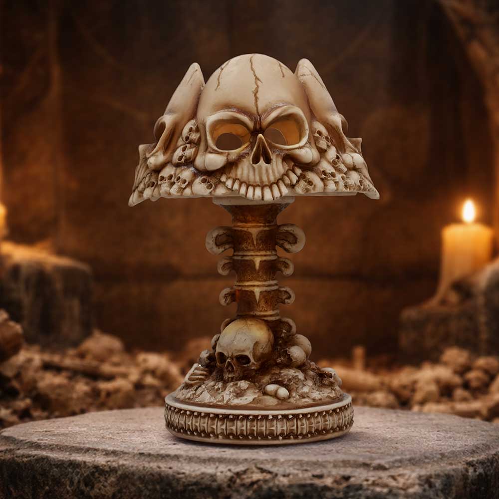 Last Light Bone Skull Lamp - bone-coloured skull lamp on a gothic display