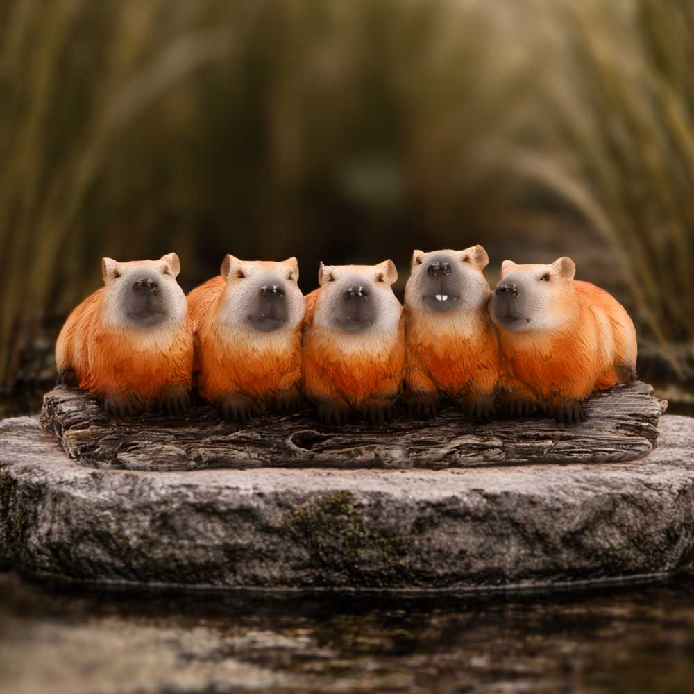 Capybara Herd Animal Figurine - capybara herd on a stone display