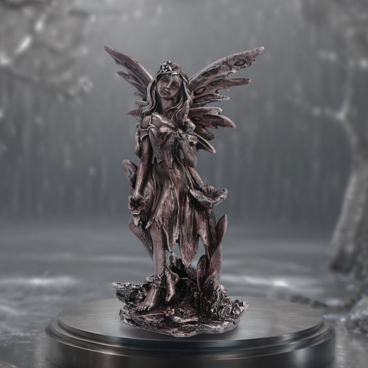Enchanted Forest Petal Fairy Figurine - fairy displayed against woodland backdrop