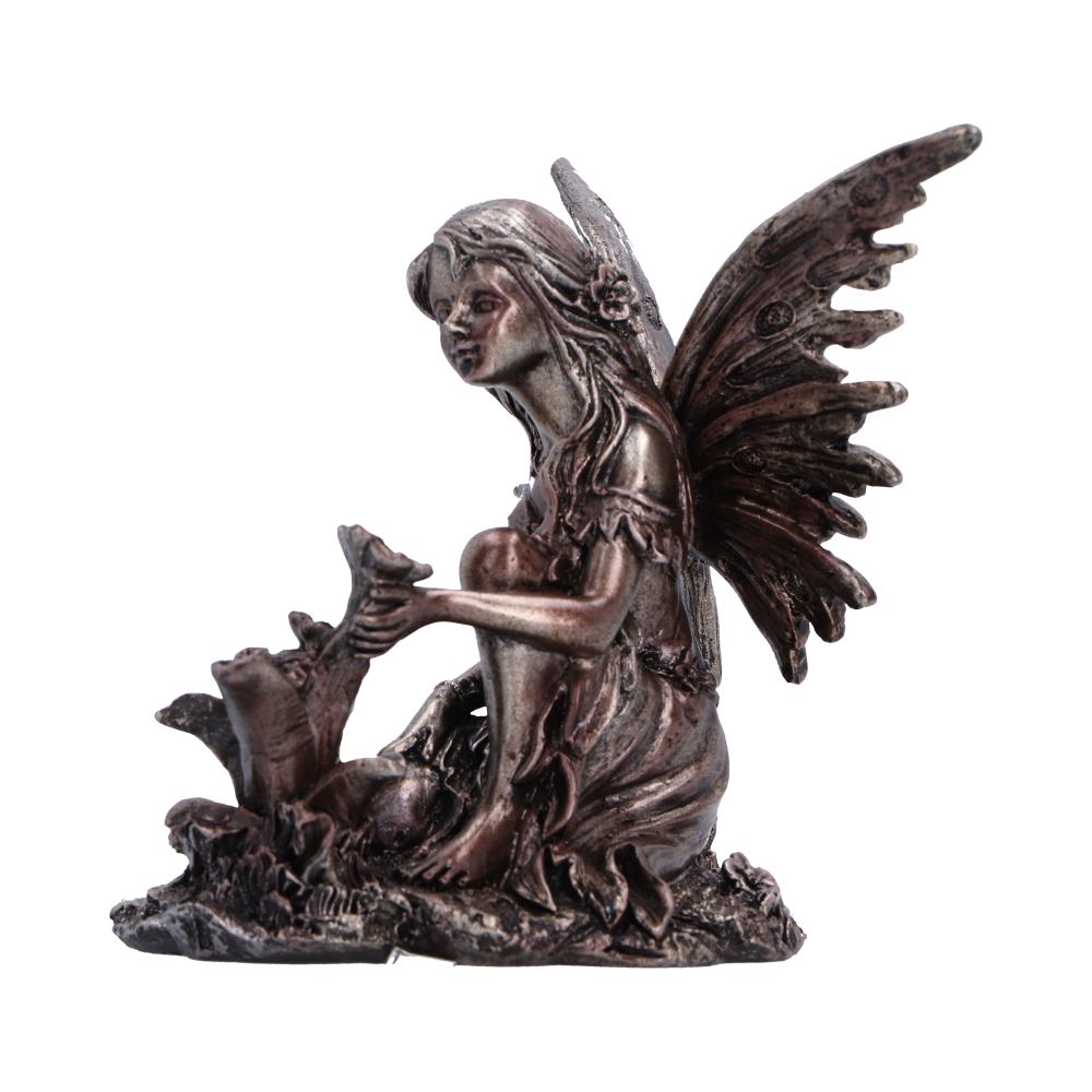 Enchanted Forest Flora Fairy Figurine - side view of fairy beside flowers
